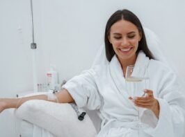 Relaxed woman receiving home healthcare treatment, blood donation, or IV therapy at home.